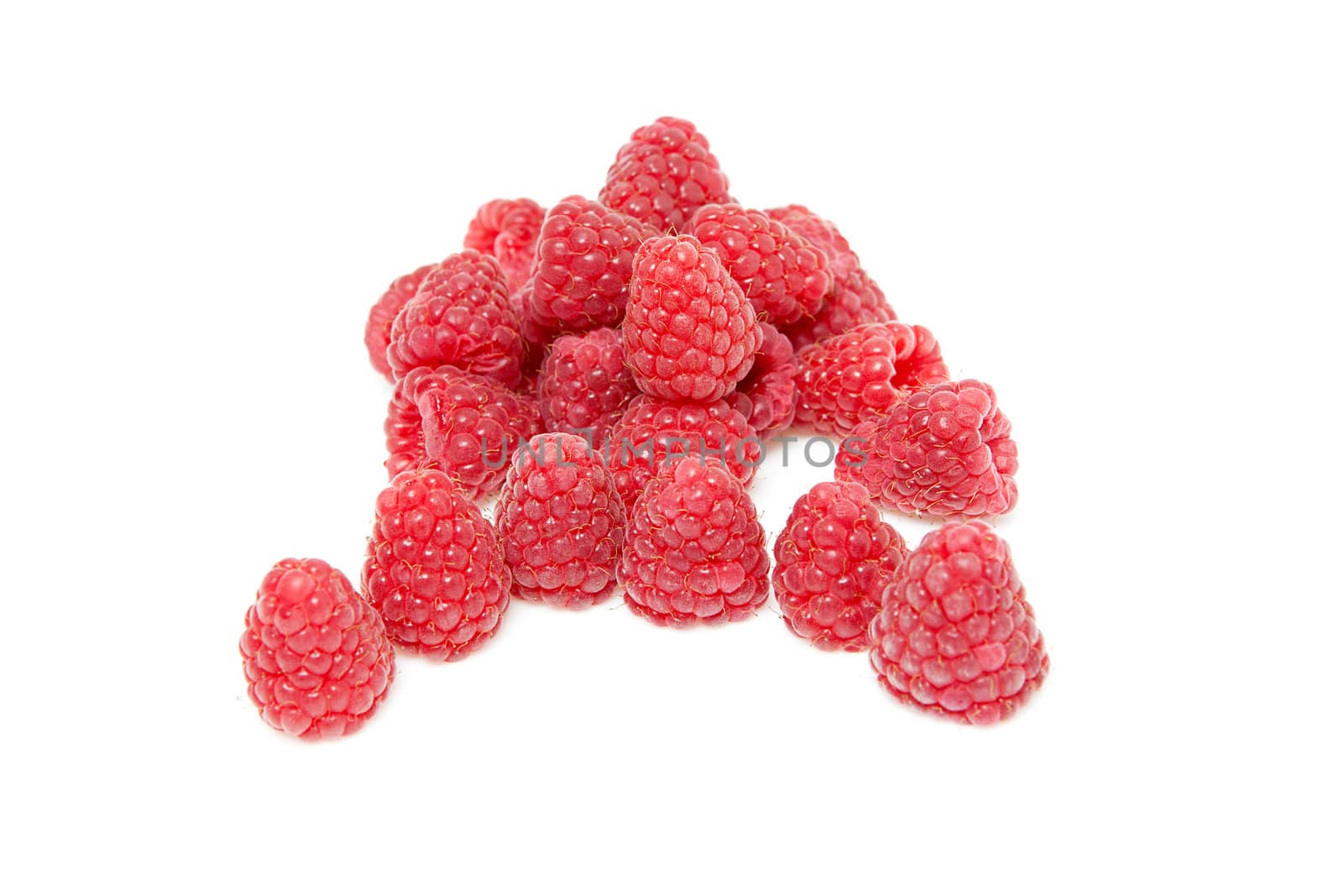 Pile of fresh raspberries isolated on white background