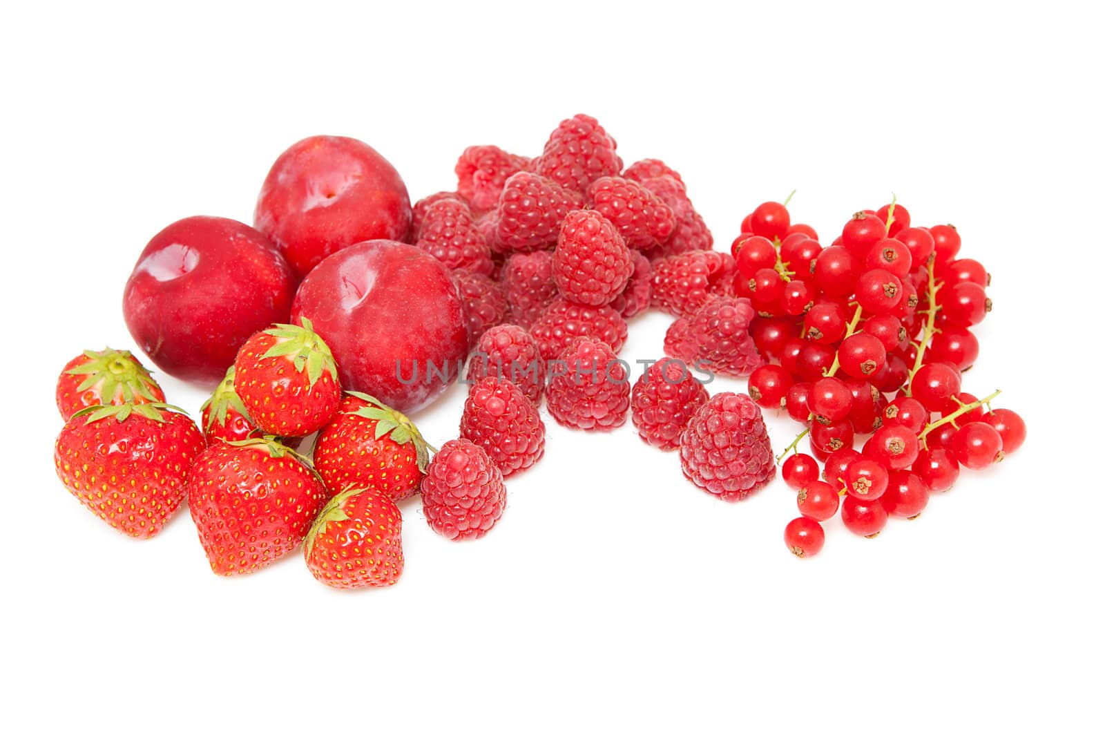 Fresh red fruits isolated on white background. raspberries, strawberries and plums