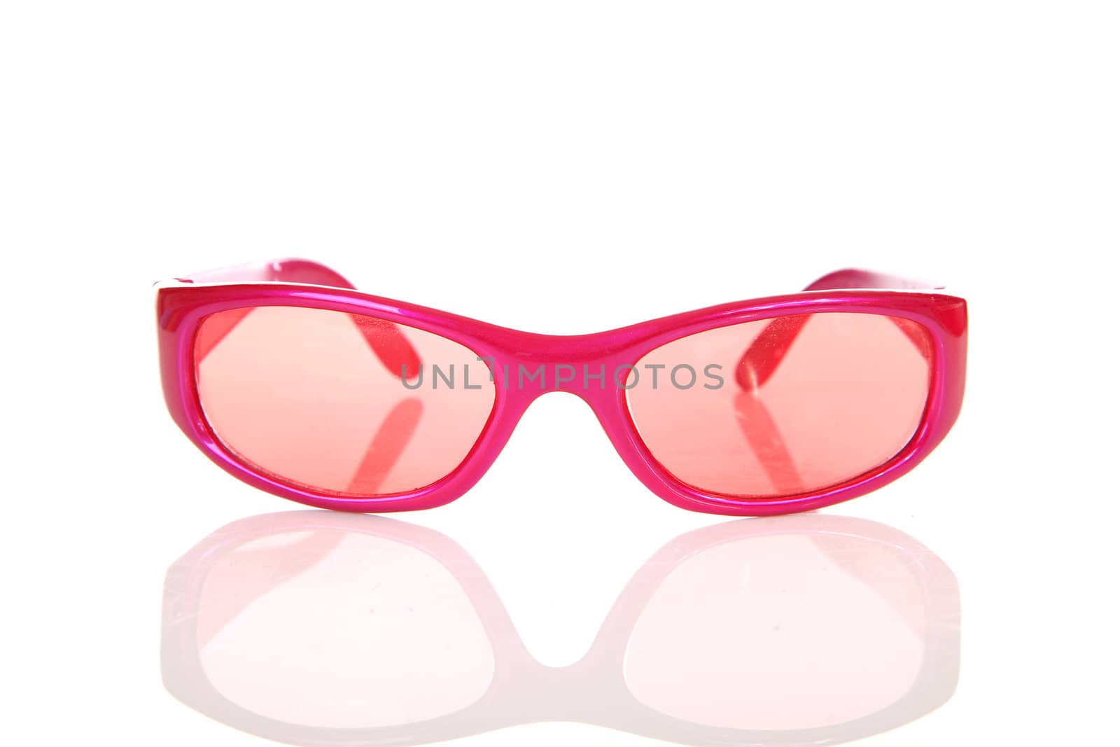 Pink sunglasses in closeup isolated on white background 
