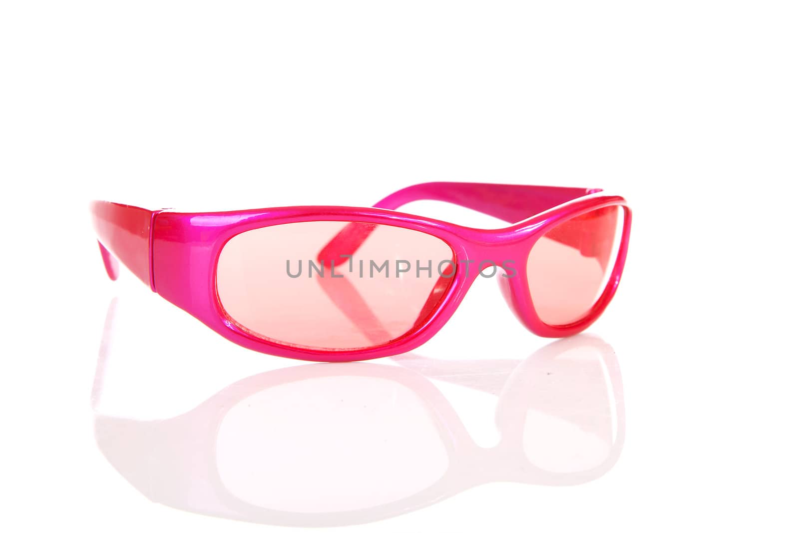 Pink sunglasses in closeup isolated on white background