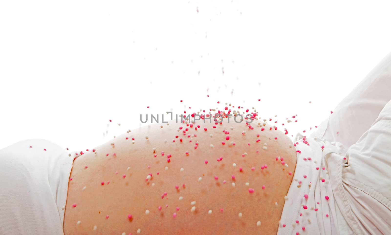 Pregnant belly with pink falling mice over white background