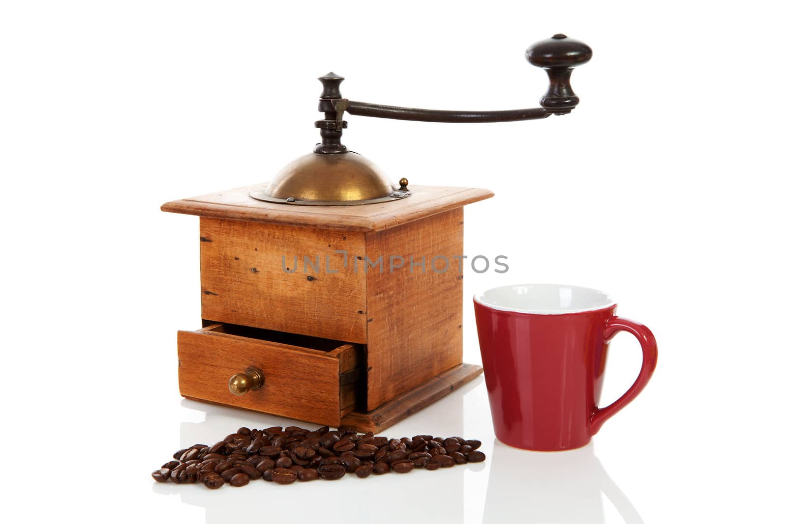 Old wooden vintage coffee grinder over white background