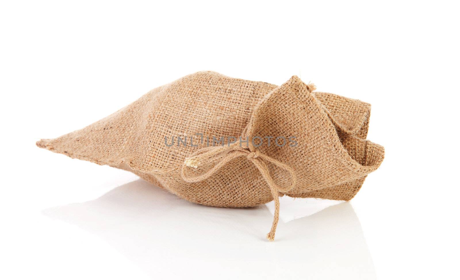 one full jute bag over white background