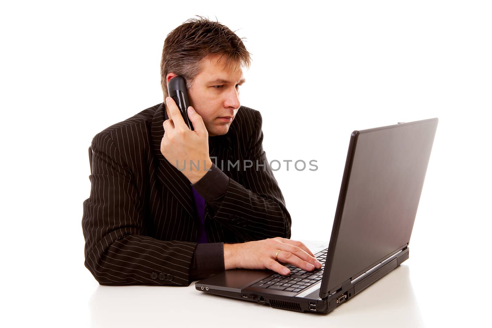 Businessman behind desk is calling over white background
