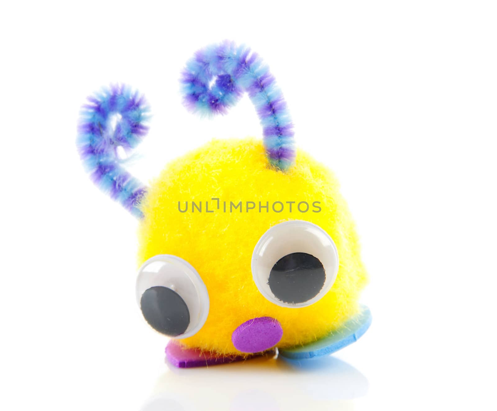 Colorful toy made by child over white background