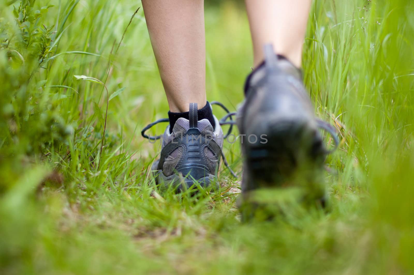 Closeup of a hiking boots in a grass