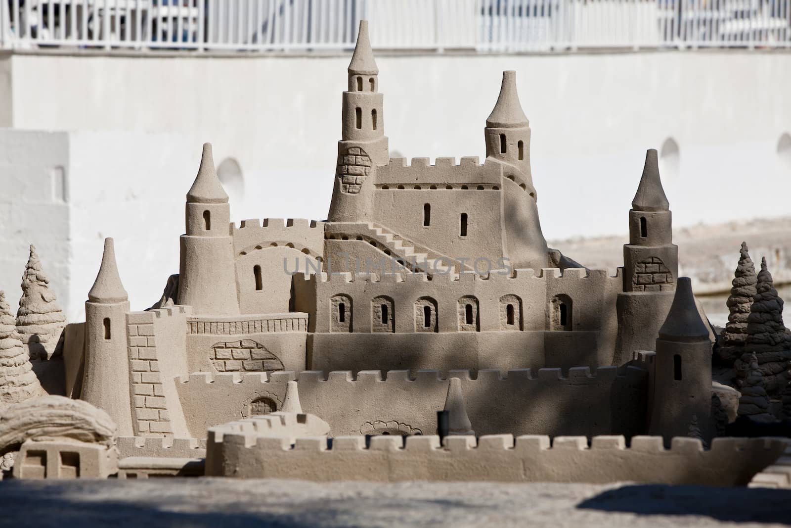 creative big sandcastle on the beach in summer blue sky