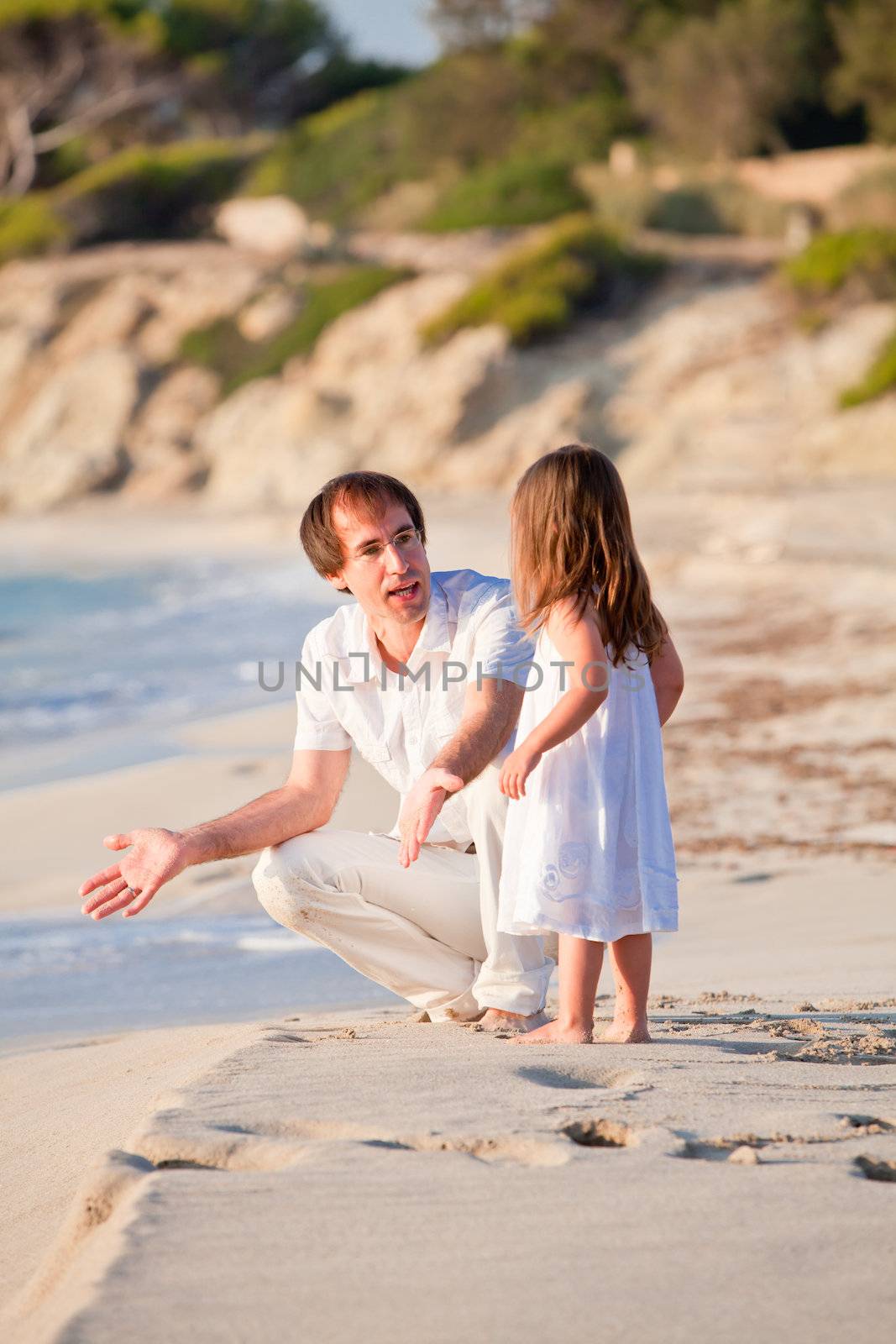 happy family father and daughter on beach having fun summer vacation