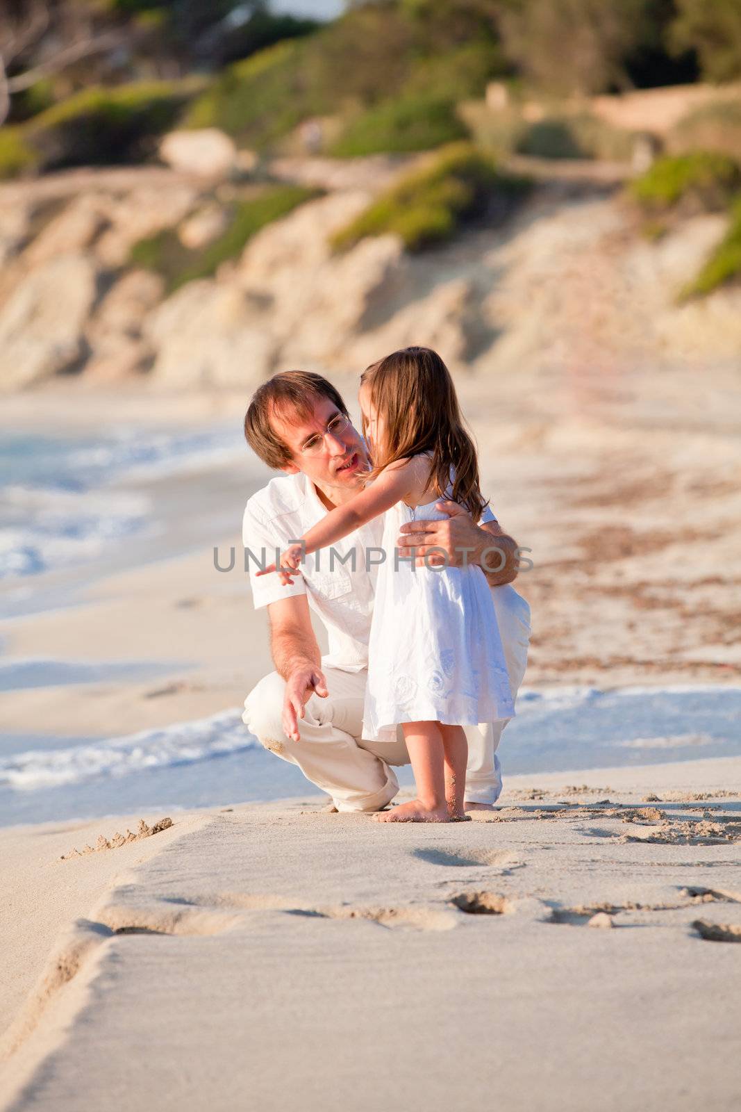 happy family father and daughter on beach having fun summer vacation