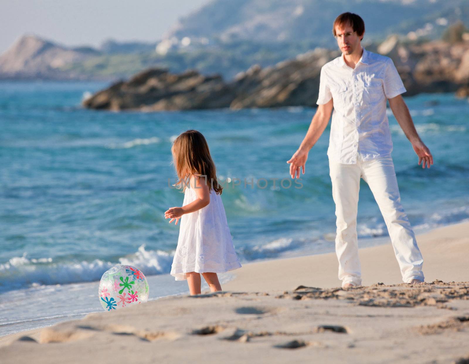 happy family father and daughter on beach having fun summer vacation