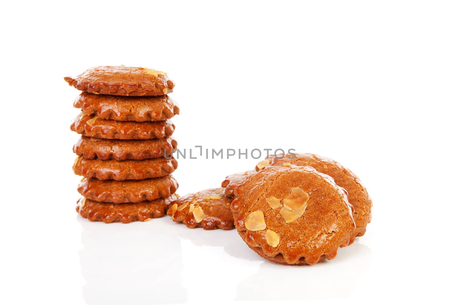 Pile of typical Dutch filled gingerbread cookies over white background