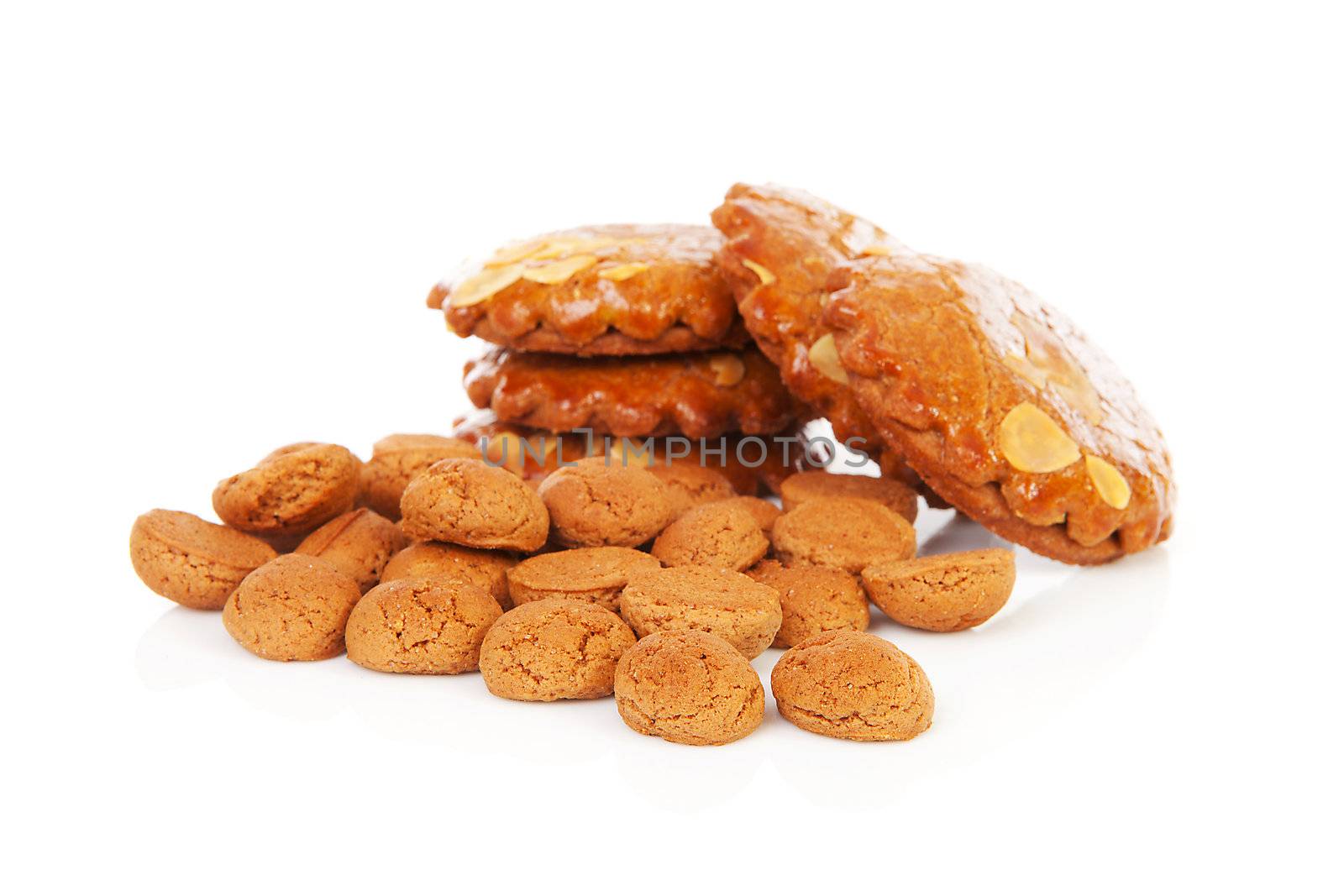 Pile of typical Dutch filled gingerbread cookies over white background