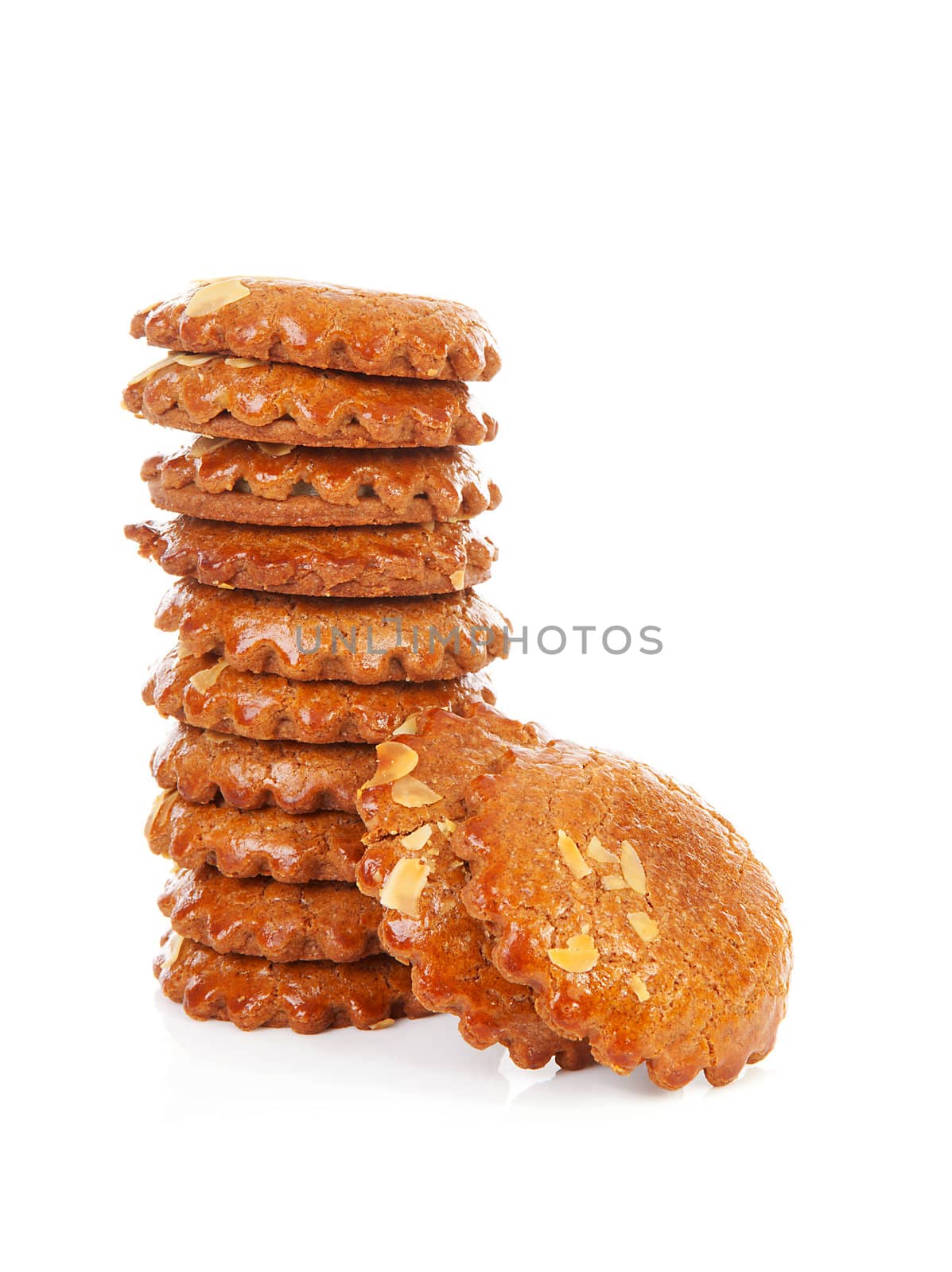 Pile of typical Dutch filled gingerbread cookies over white background