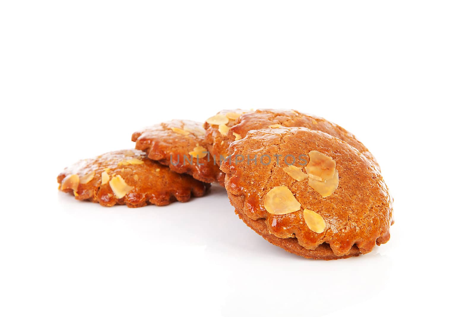 Pile of typical Dutch filled gingerbread cookies over white background