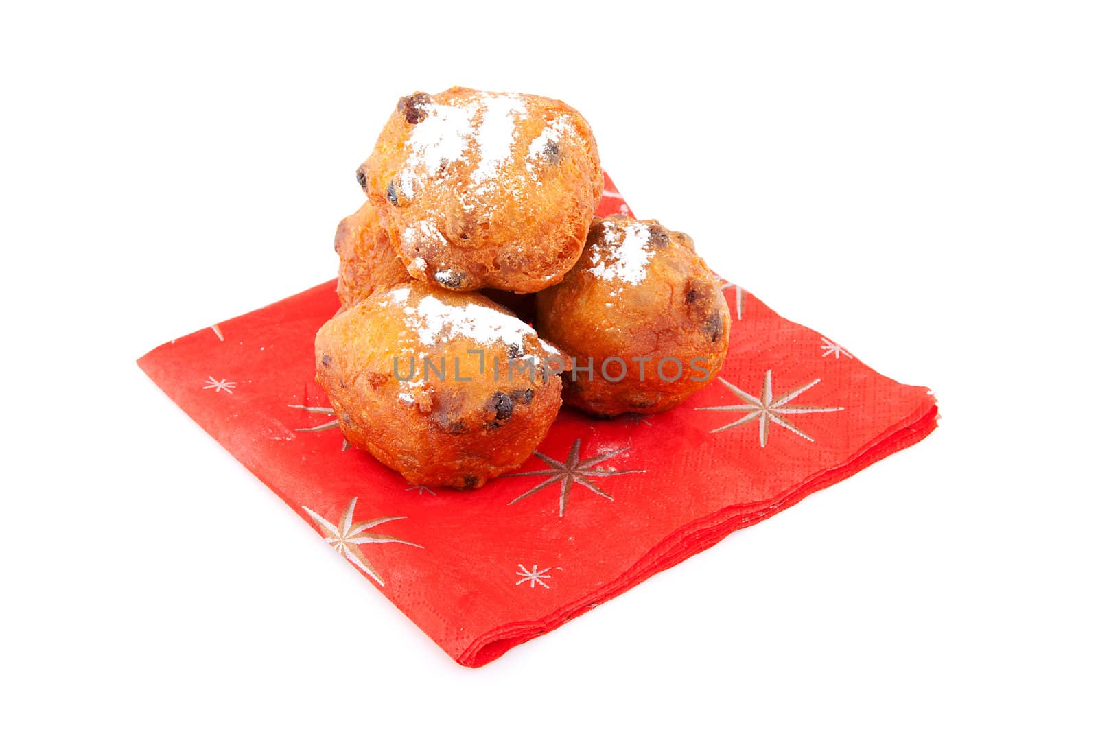 Pile of Dutch donut also known as oliebollen, traditional New Year's eve food isolated on white background