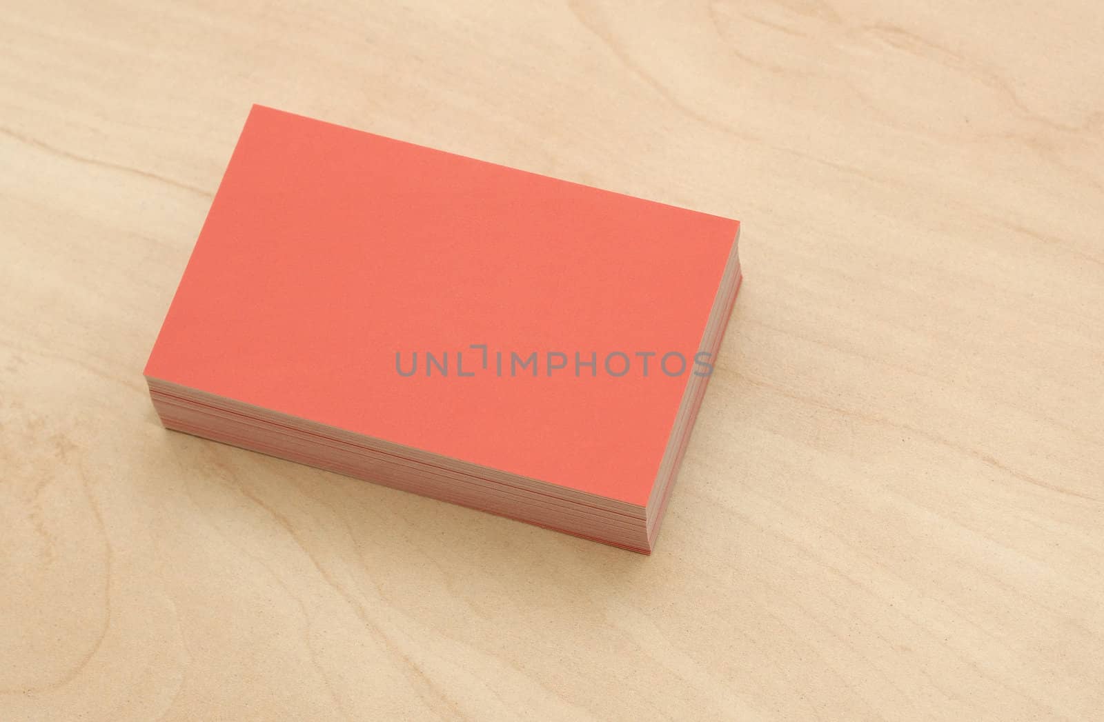 block of business cards on a wooden table