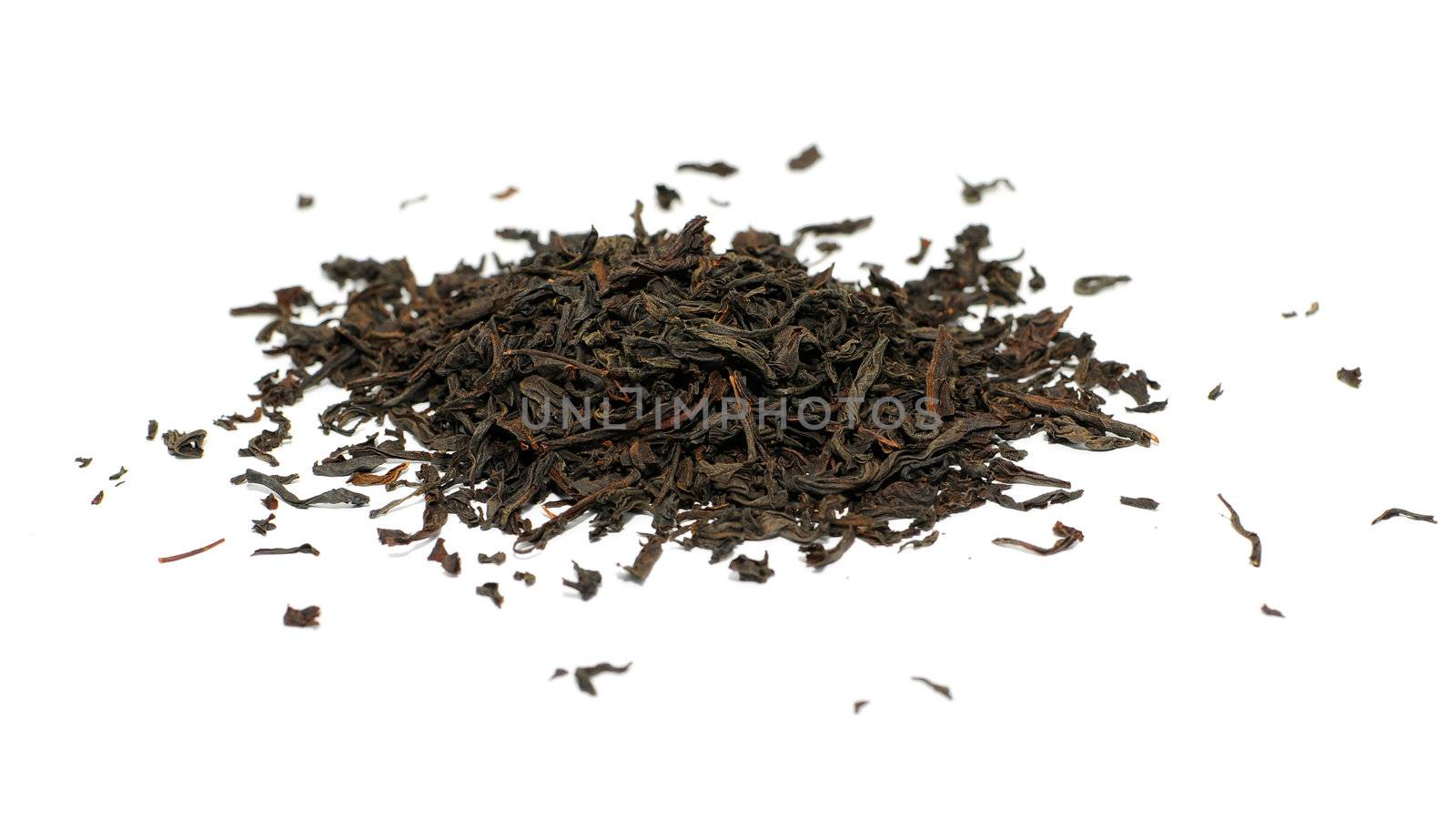 Black tea loose dried tea leaves, isolated by DNKSTUDIO