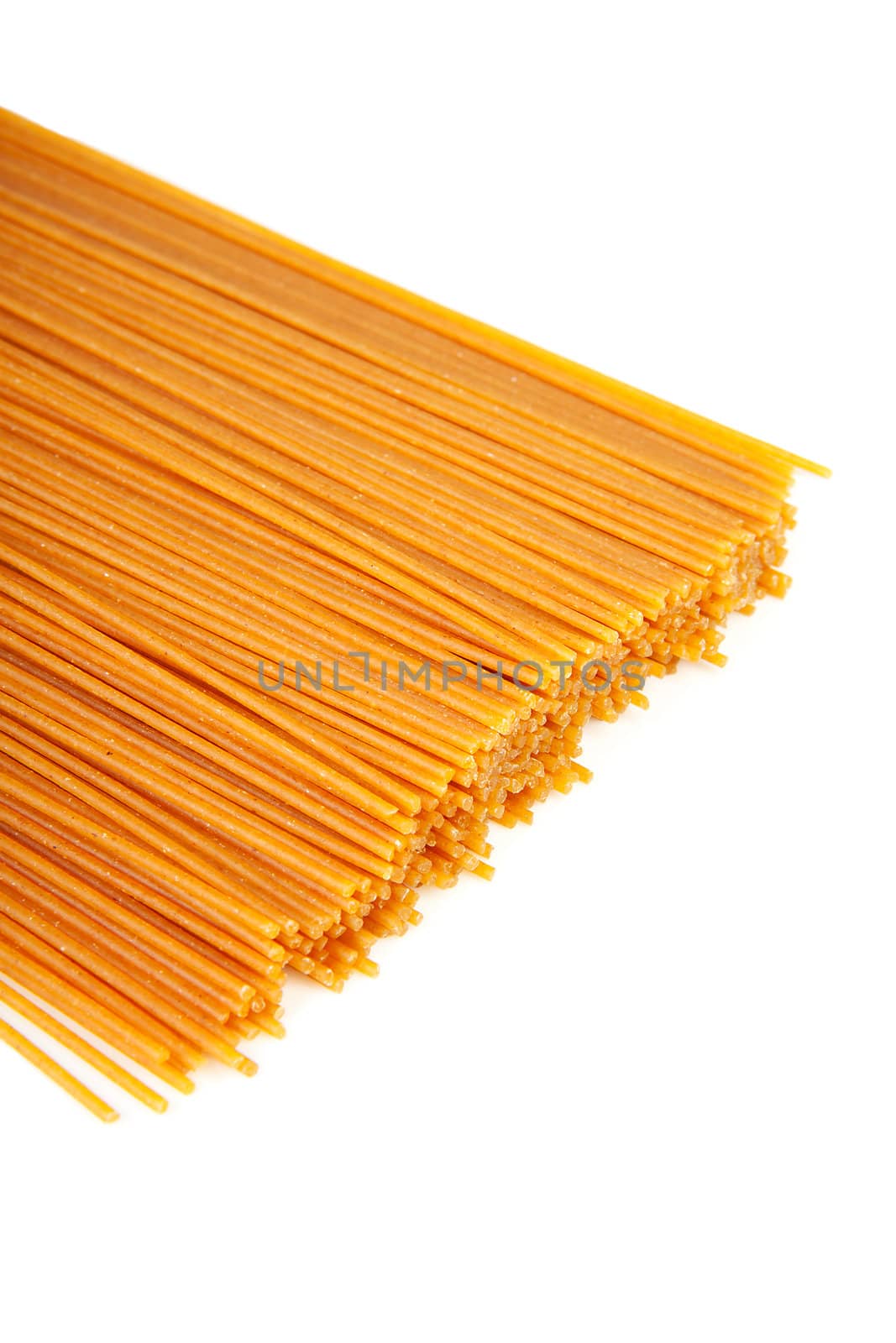 bundle of raw spaghetti over white background