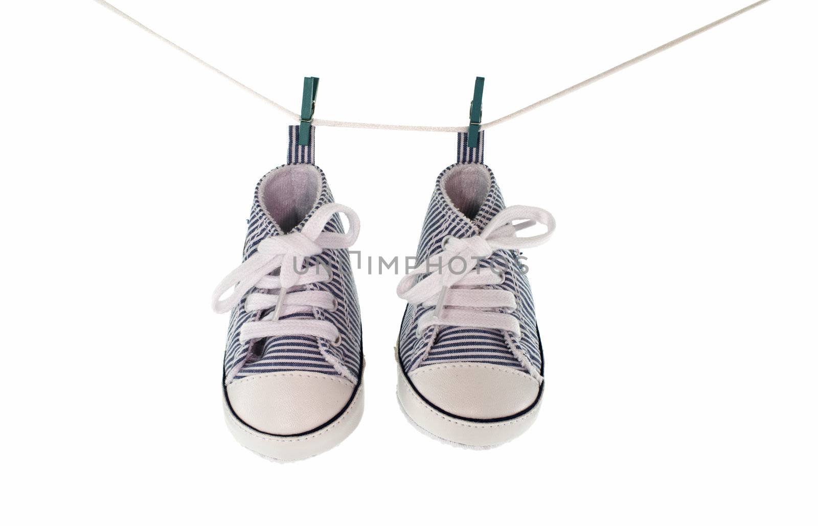 baby shoes hanging by compuinfoto