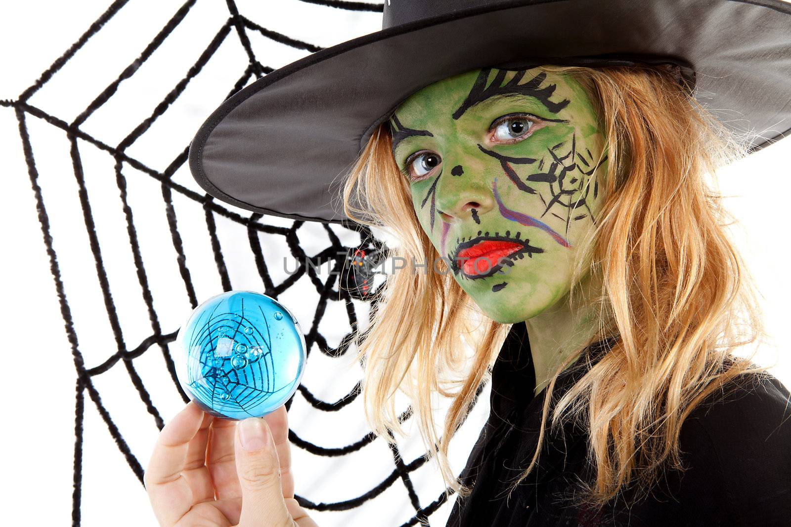 green Halloween witch girl in closeup holding big blue marble by sannie32