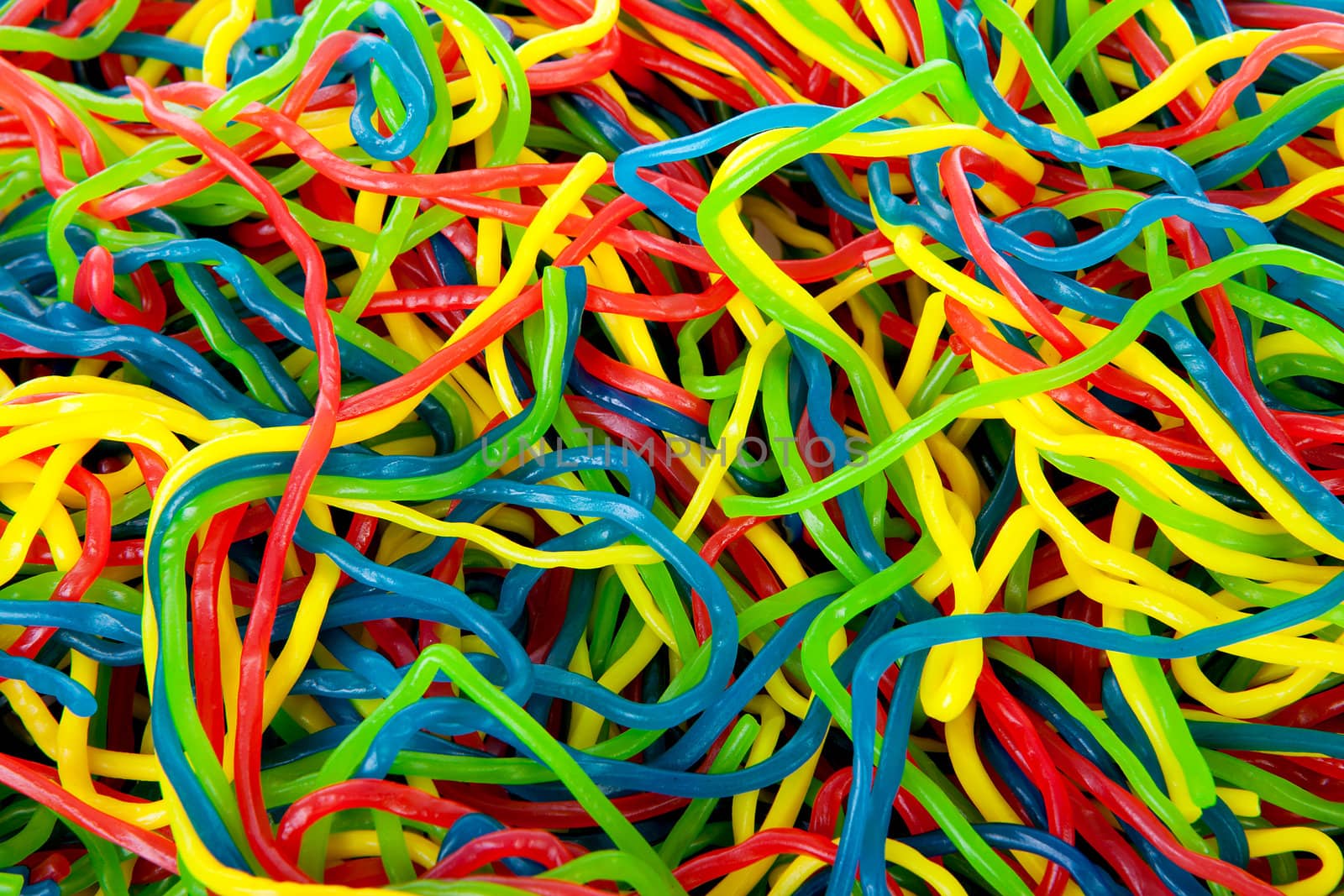 background of colorful fruit laces candy in closeup