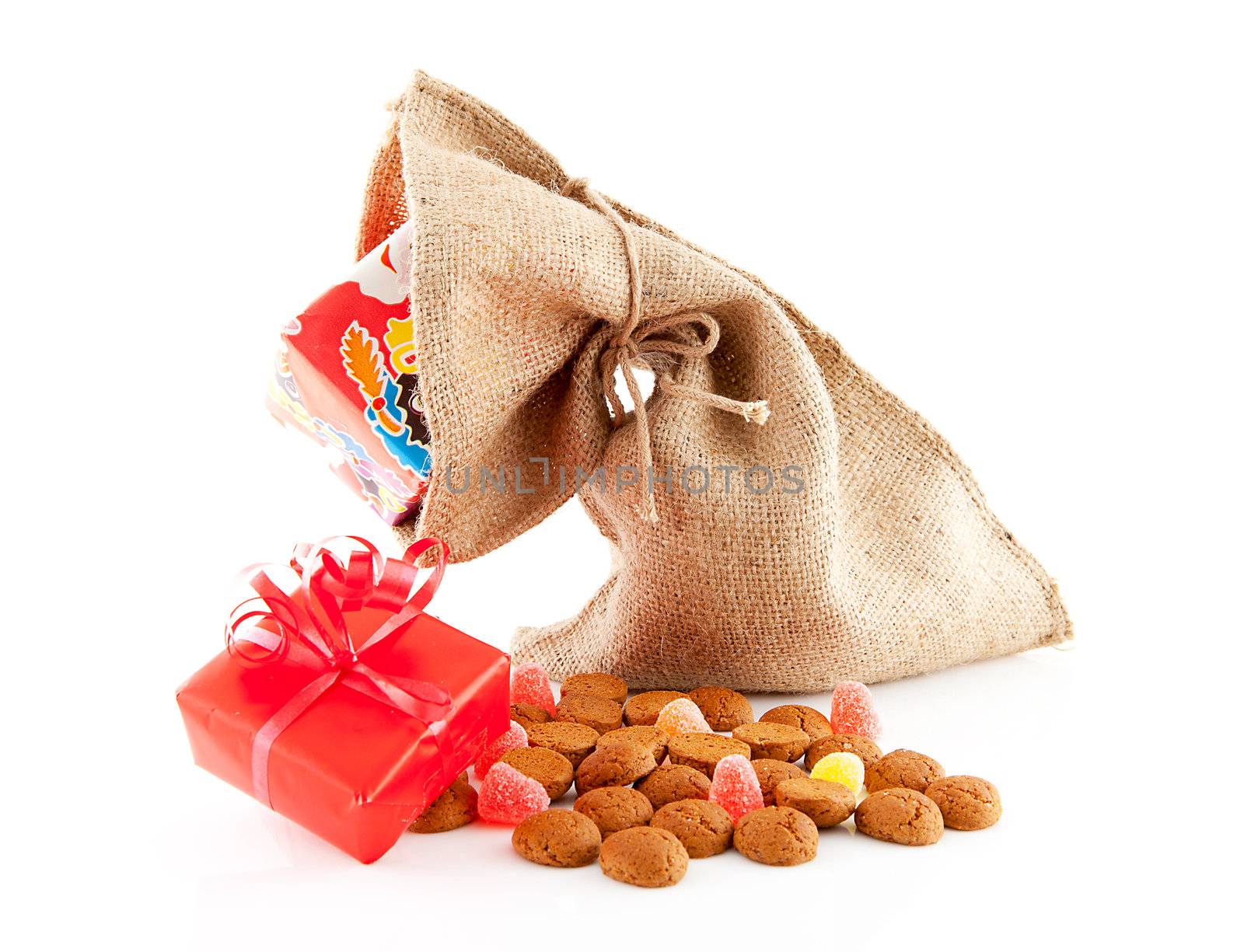Typical Dutch celebration: Sinterklaas with surprises in bag and ginger nuts, ready for the kids in december. Isolated on white background