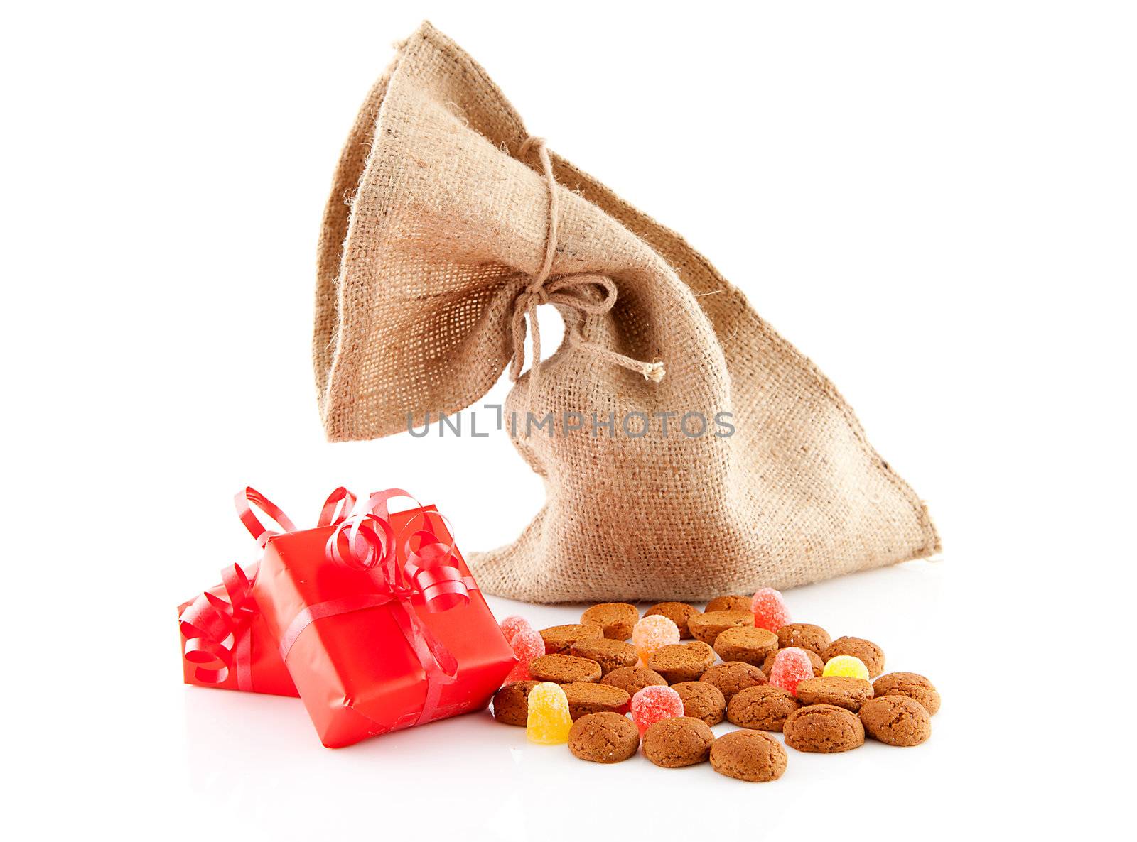 Typical Dutch celebration: Sinterklaas with surprises in bag and ginger nuts, ready for the kids in december. Isolated on white background