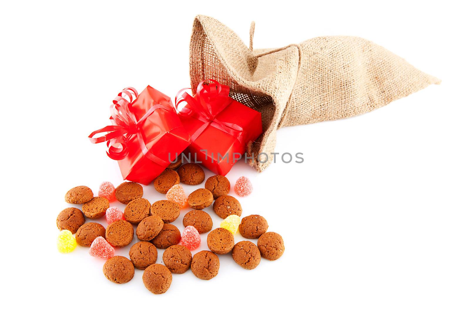 Typical Dutch celebration: Sinterklaas with surprises in bag and ginger nuts, ready for the kids in december. Isolated on white background