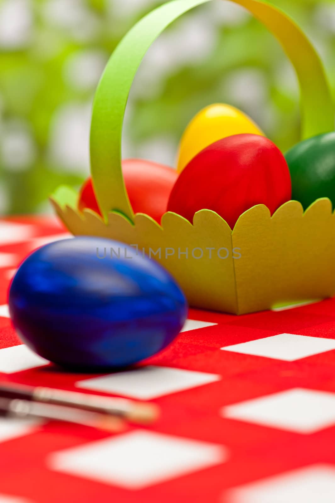Handcrafted easter eggs with green egg basket
