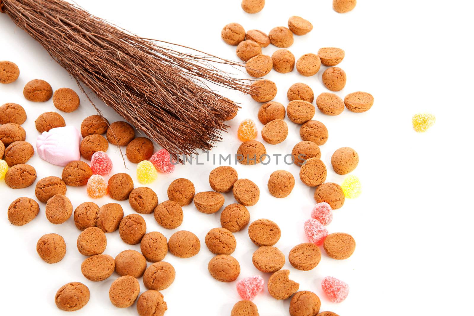 Roe of black Pete ( zwarte Piet) and pepernoten ( ginger nuts) over white background