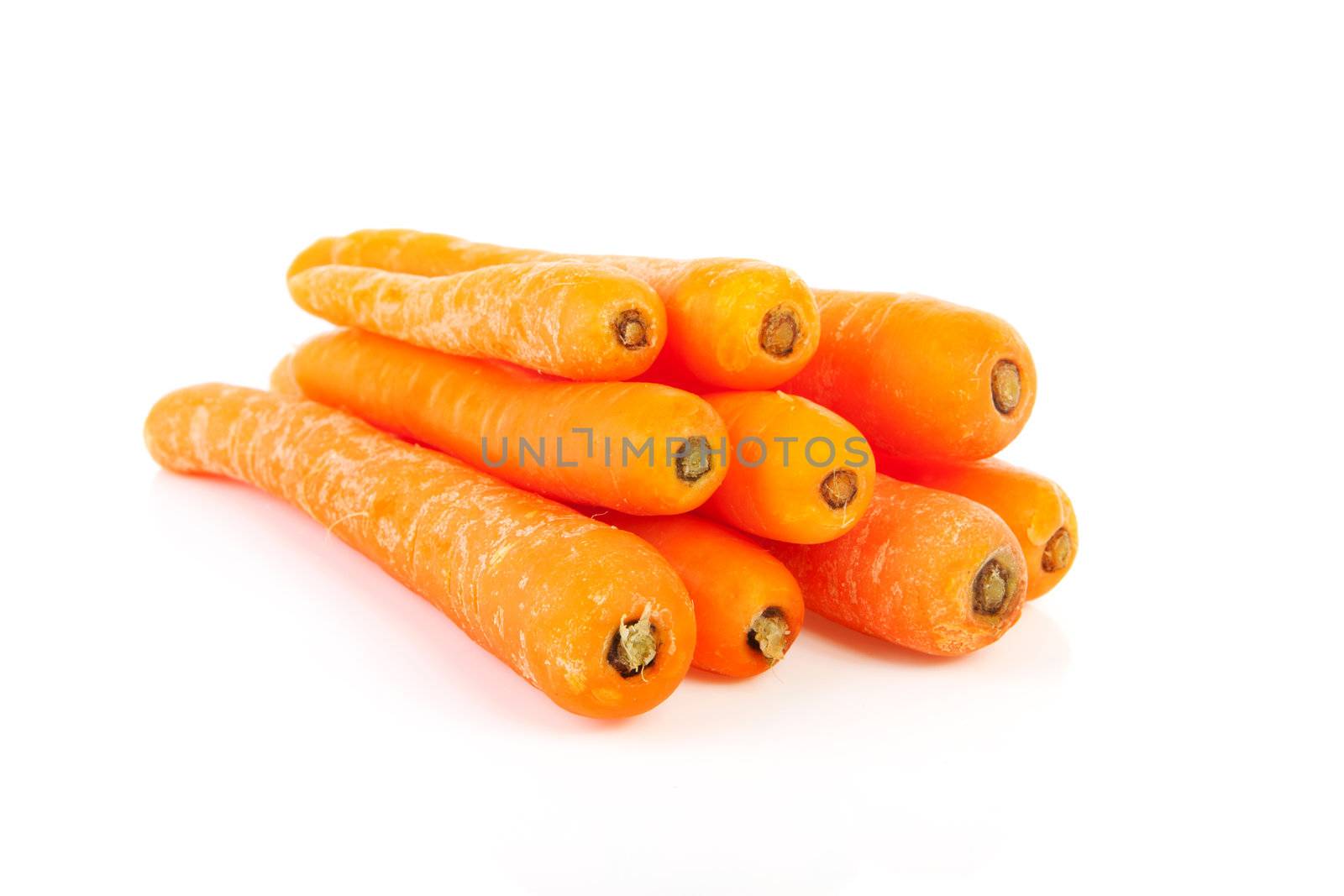 Pile of fresh carrots isolated on white background