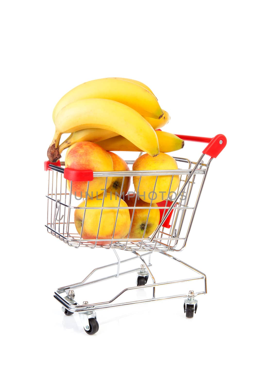 Shopping cart with fresh fruits over white background
