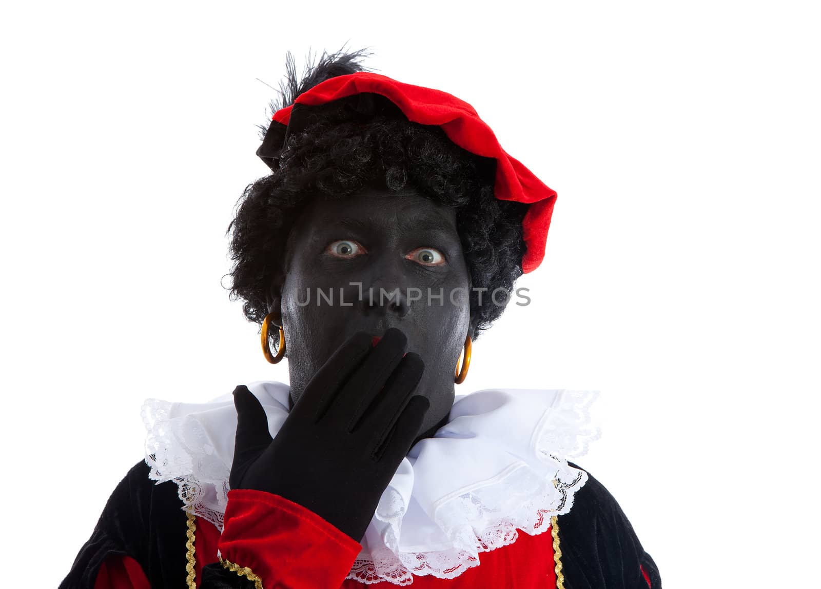 Zwarte piet ( black pete) typical Dutch character part of a traditional event celebrating the birthday of Sinterklaas in december over white background is looking surprised