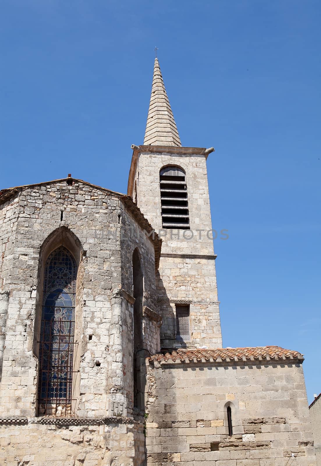 Tower of church in France against blue sky
