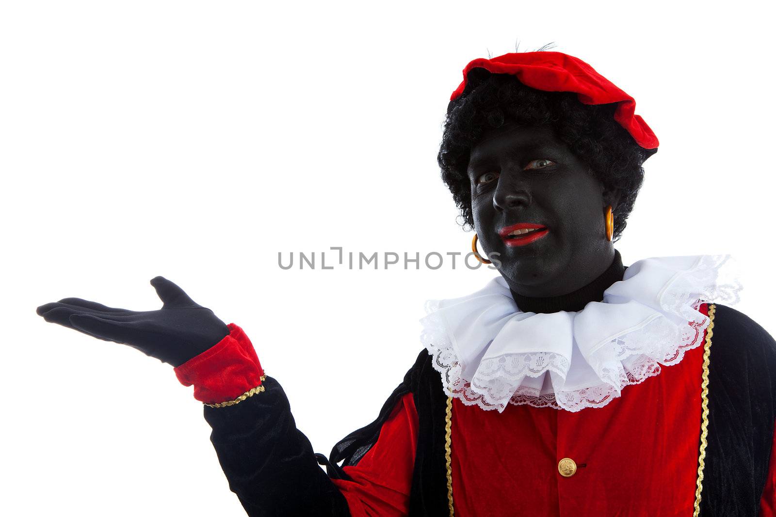 Zwarte piet ( black pete) typical Dutch character part of a traditional event celebrating the birthday of Sinterklaas in december over white background is pointing