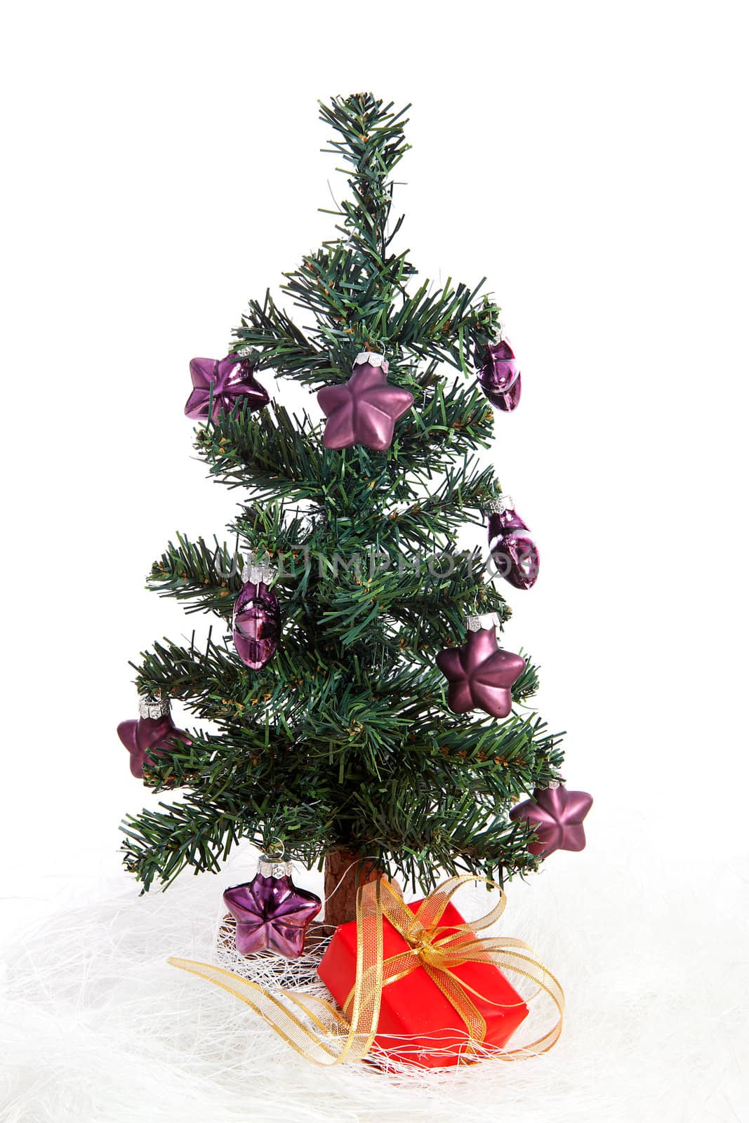 plastic christmas tree with purple stars and red present isolated on white background