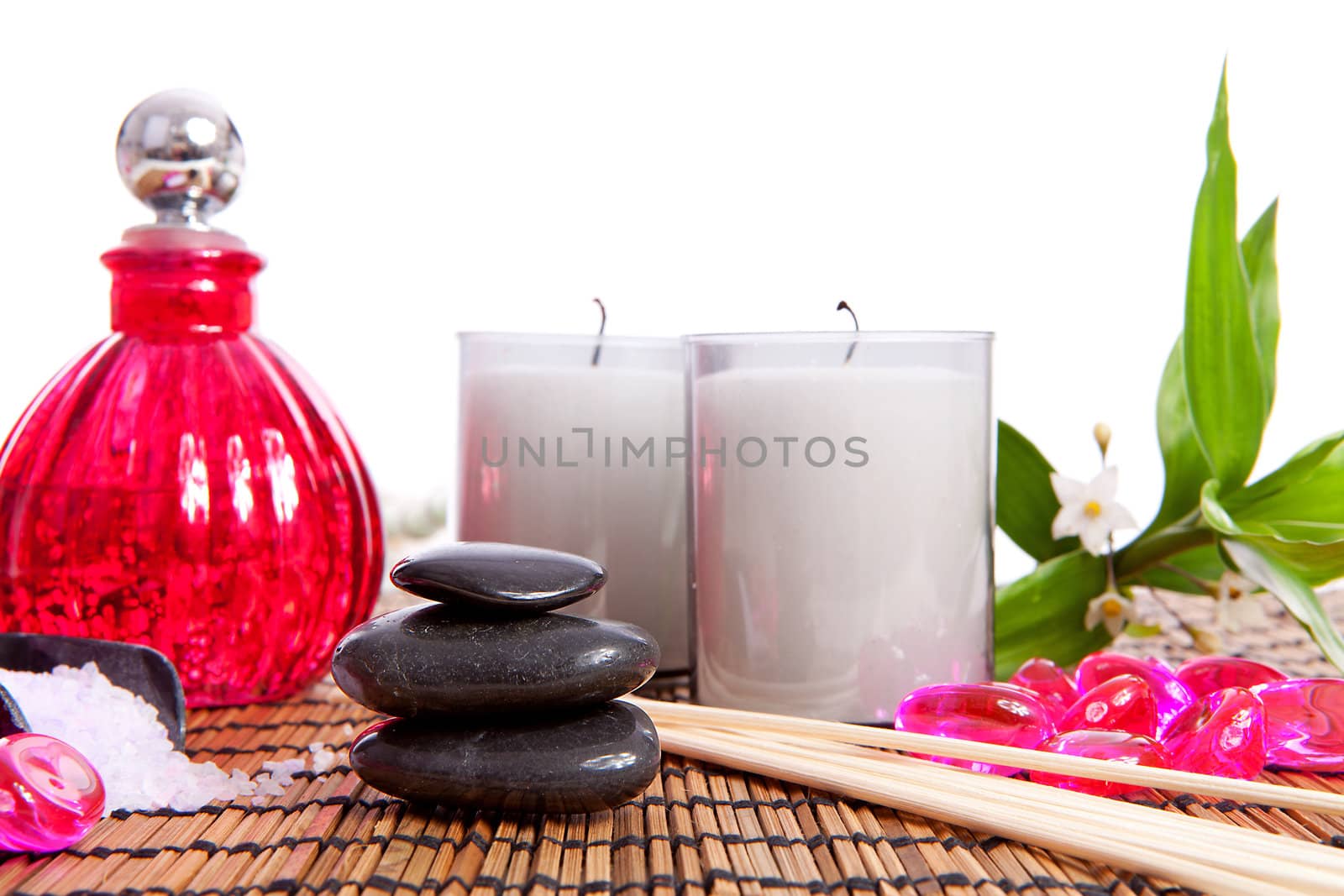 pink spa zen accessories and bamboo on cane mat