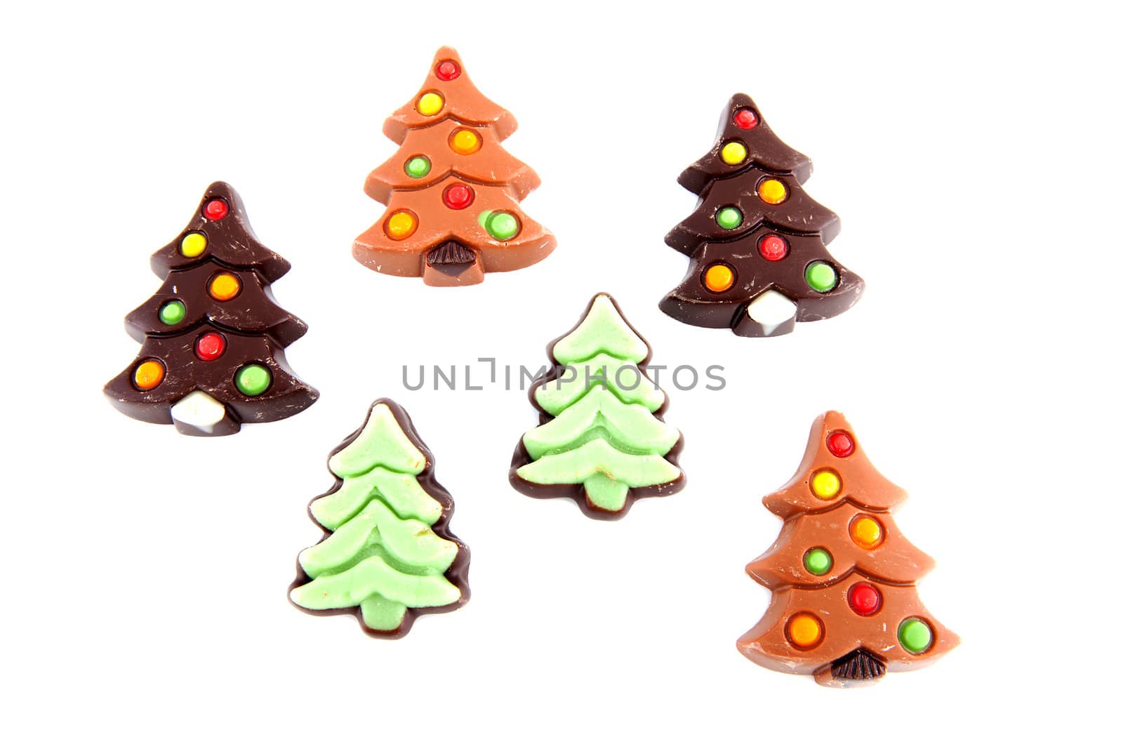 christmas chocolate candy in shape of tree over white background