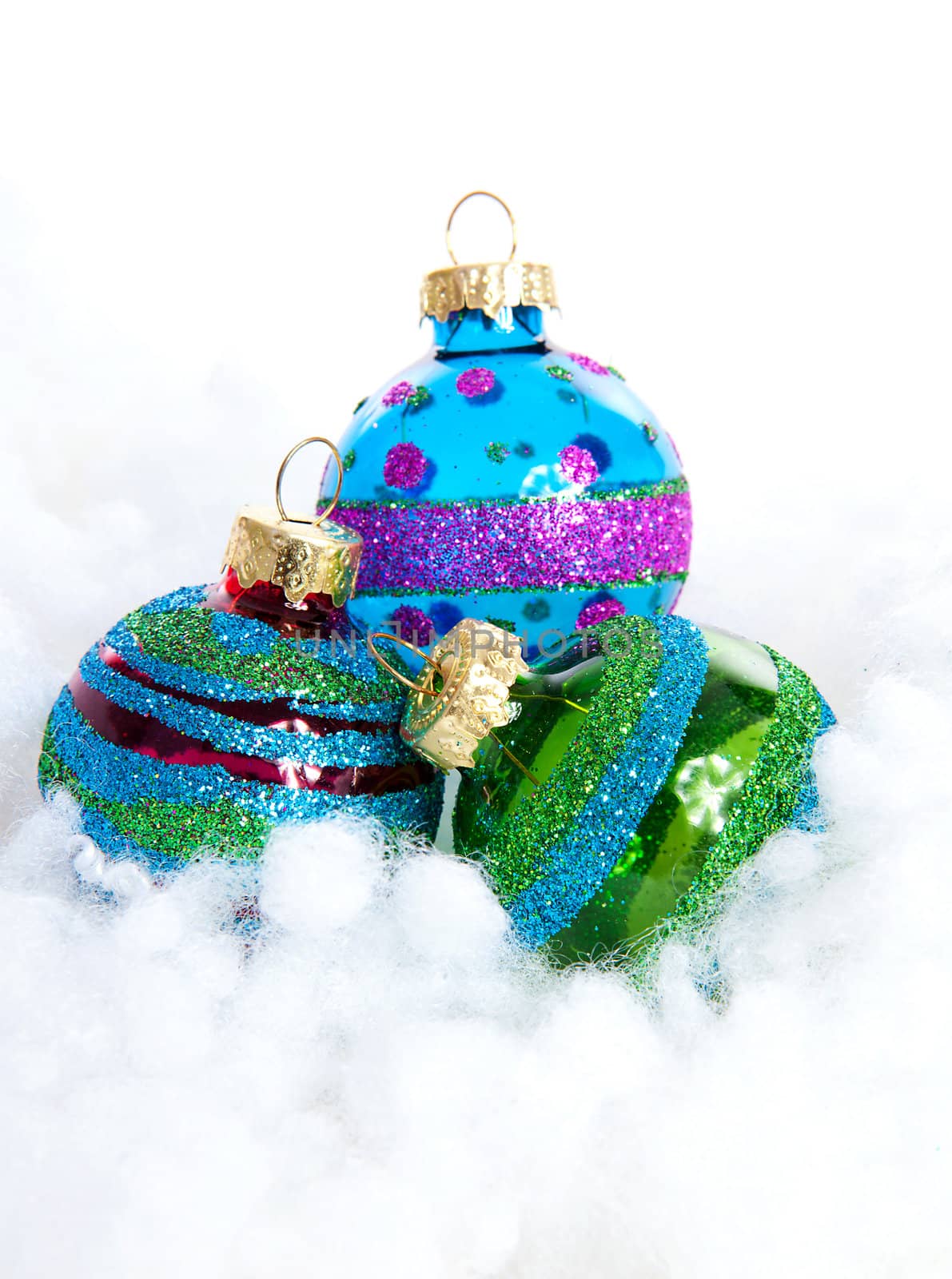 Colorful glitter Christmas balls over white background