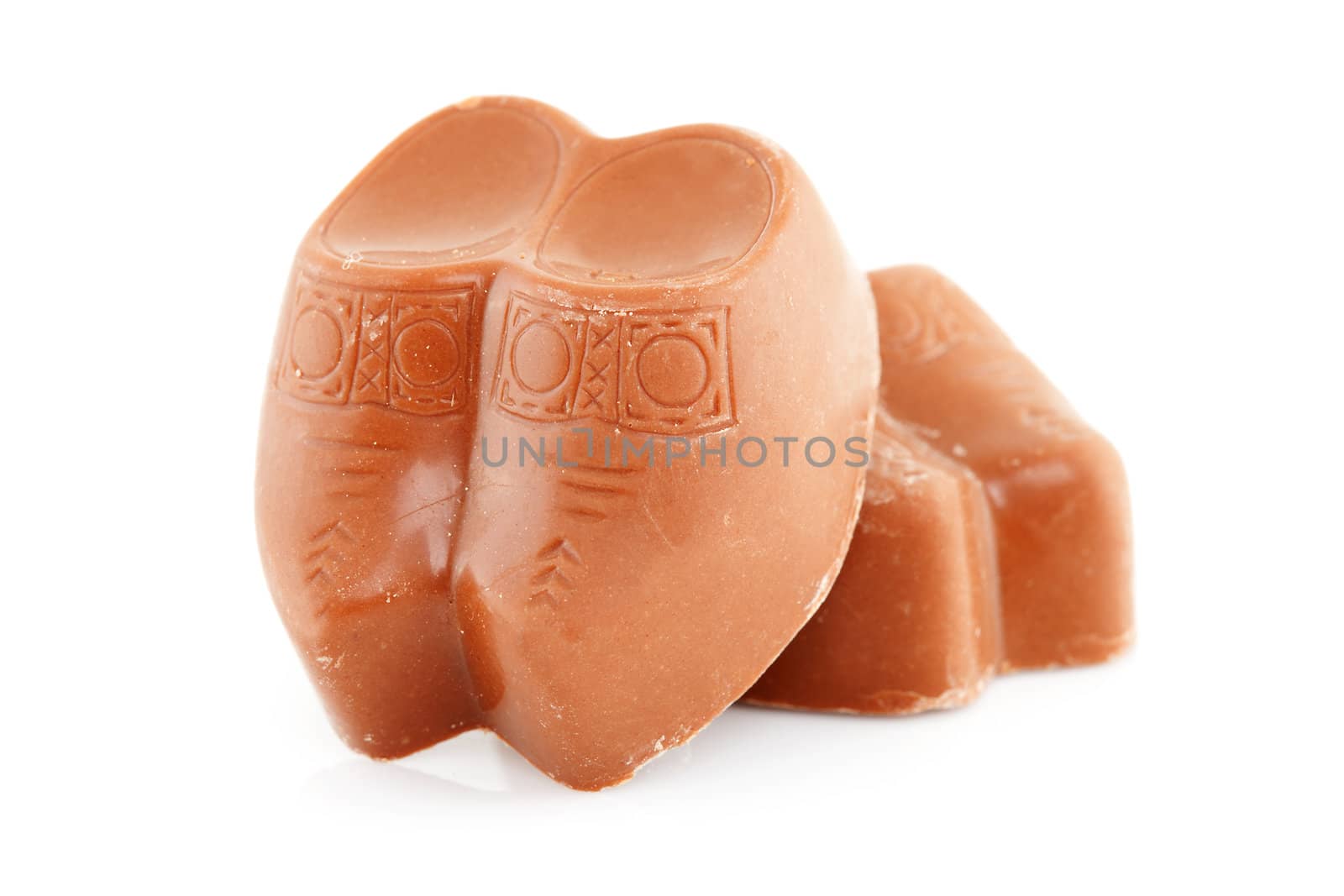 Couple of Dutch chocolate clogs over white background