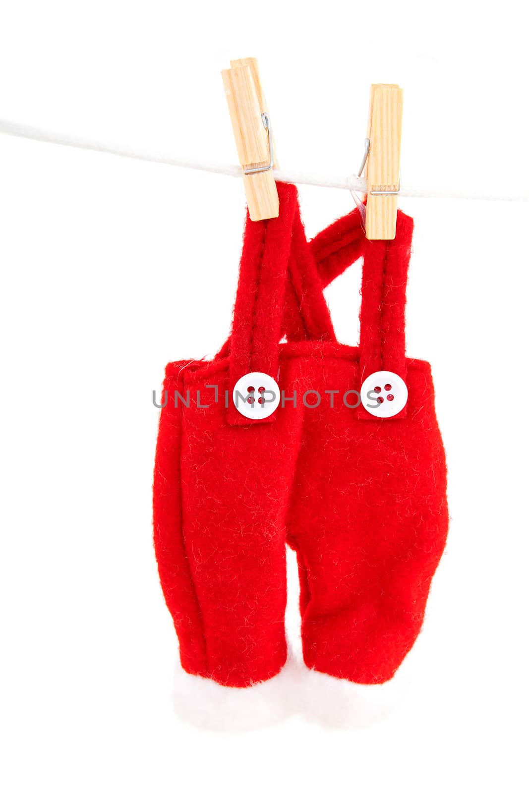 pants of Santa hanging at the clothesline over white background