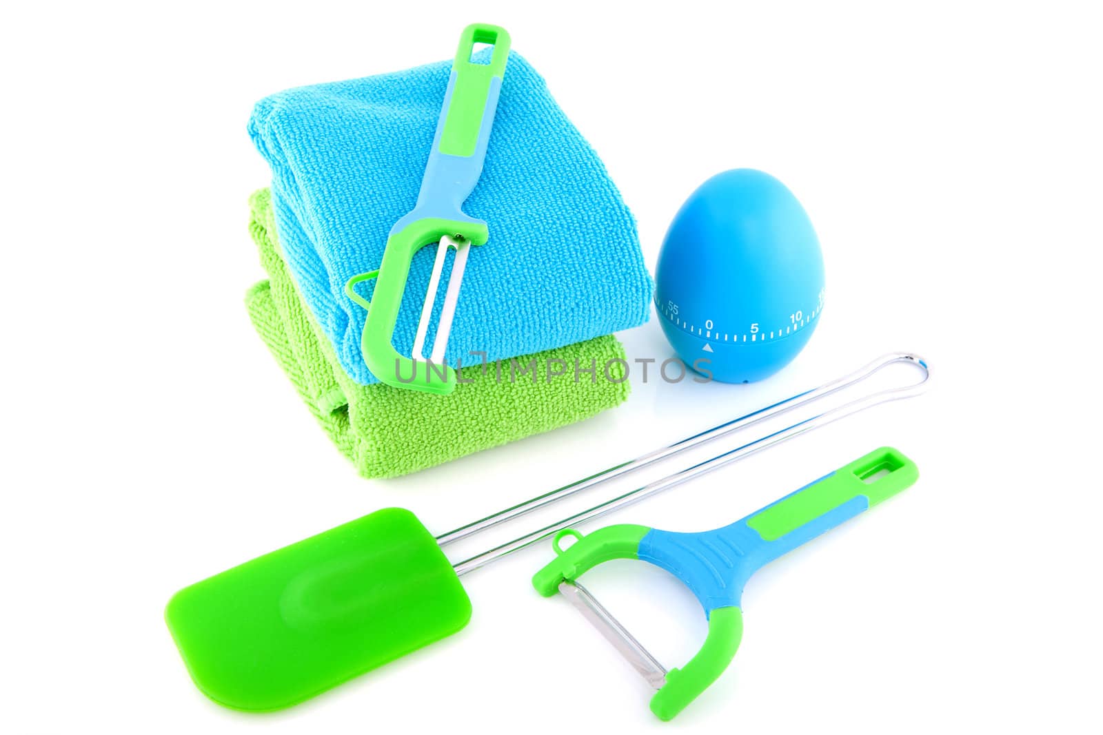 Couple of colorful kitchen utensils over white background