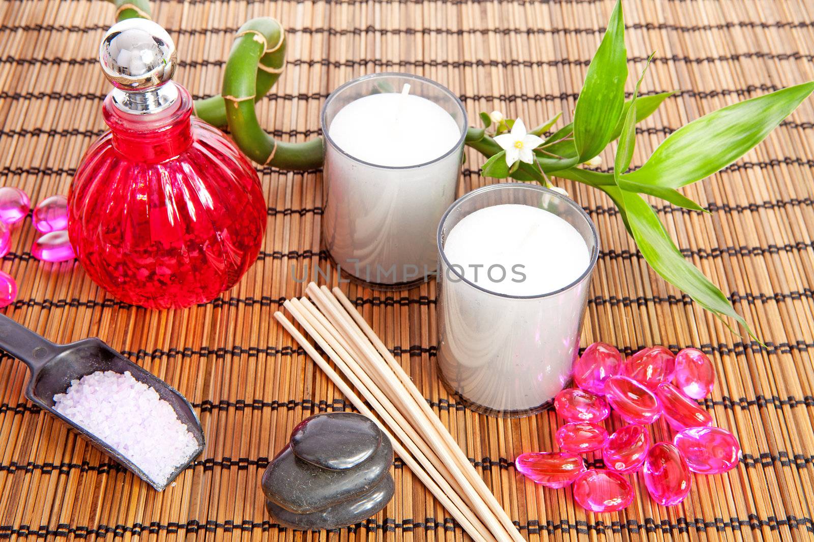 pink spa zen accessories and bamboo on cane mat