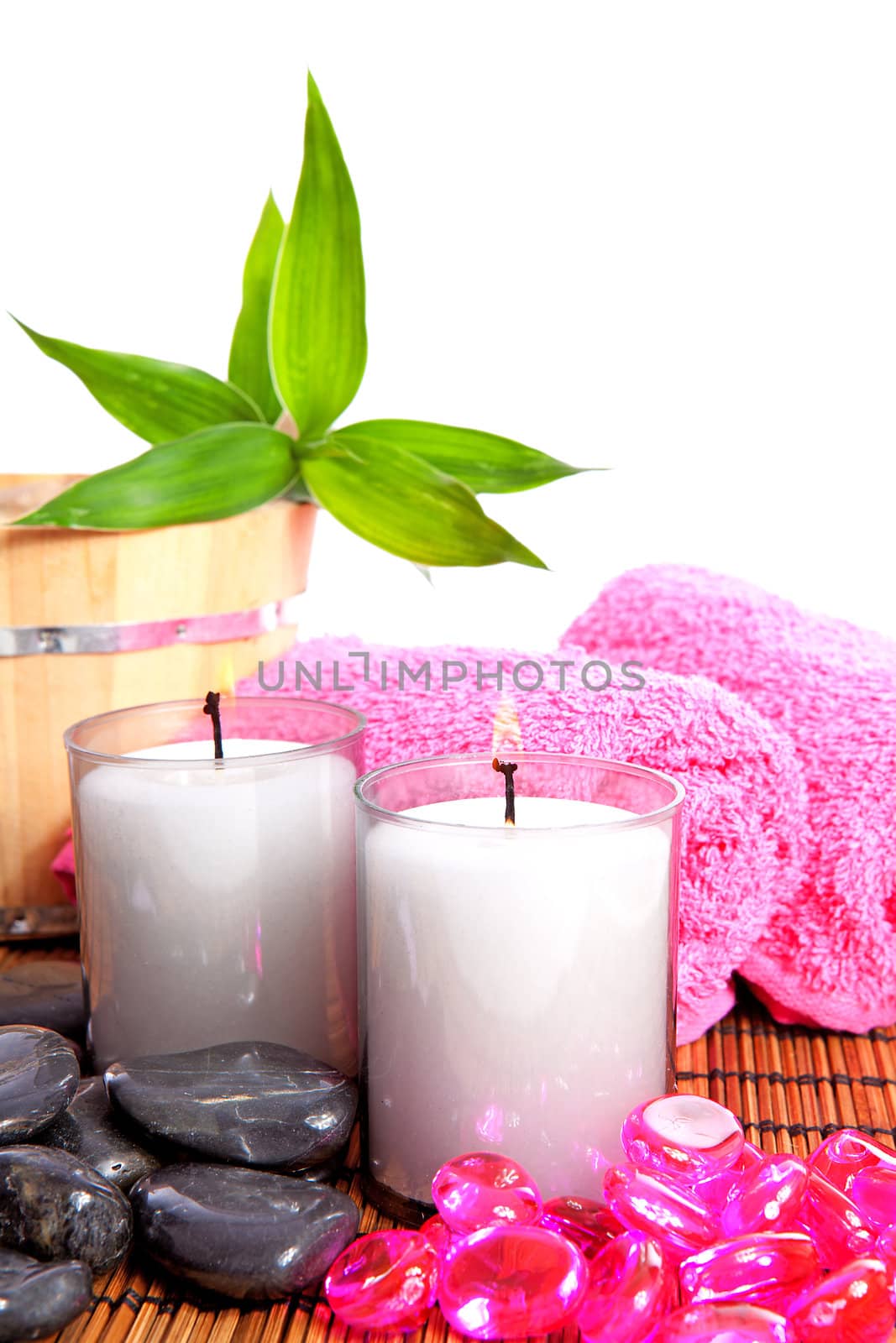 pink spa zen accessories and bamboo on cane mat