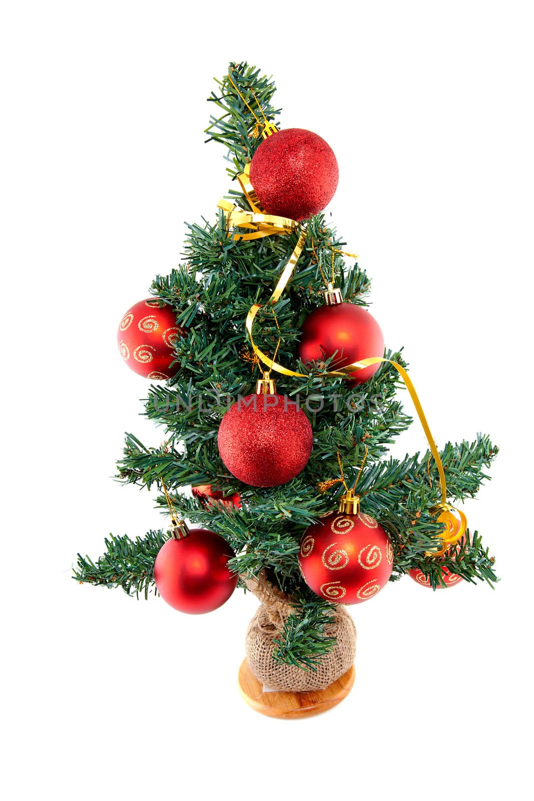 plastic christmas tree withred balls isolated on white background 
