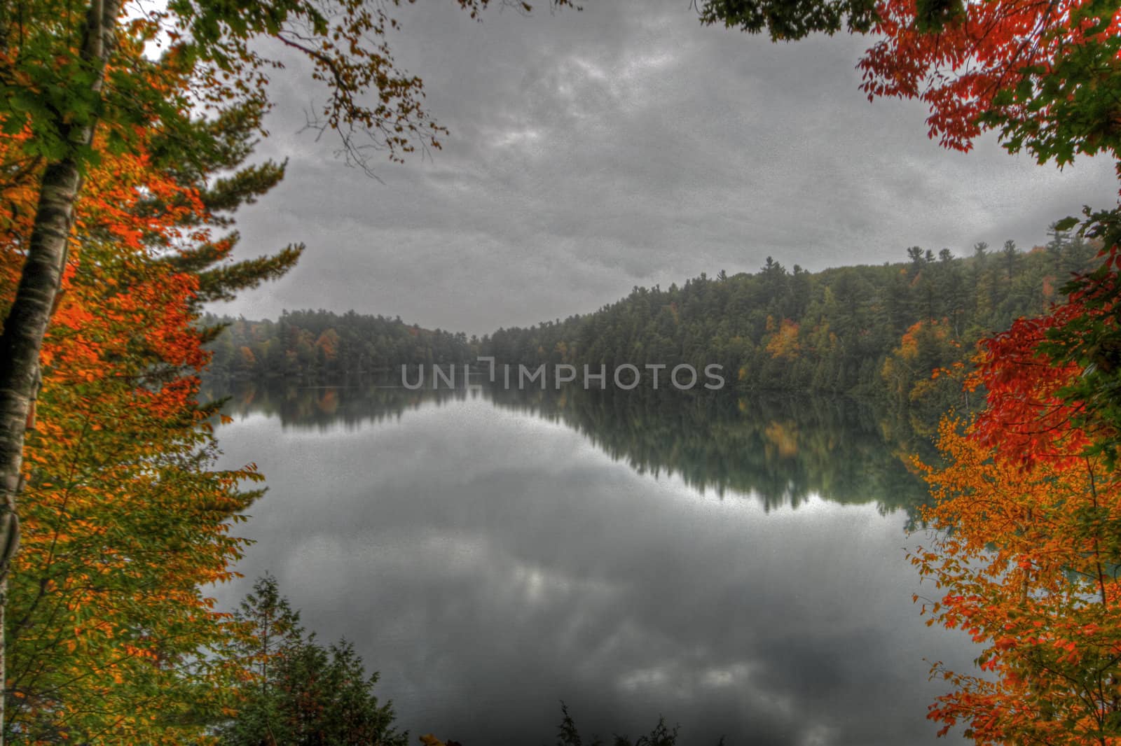 Fall foilage reflecting on Pink Lake in Gatineau Park