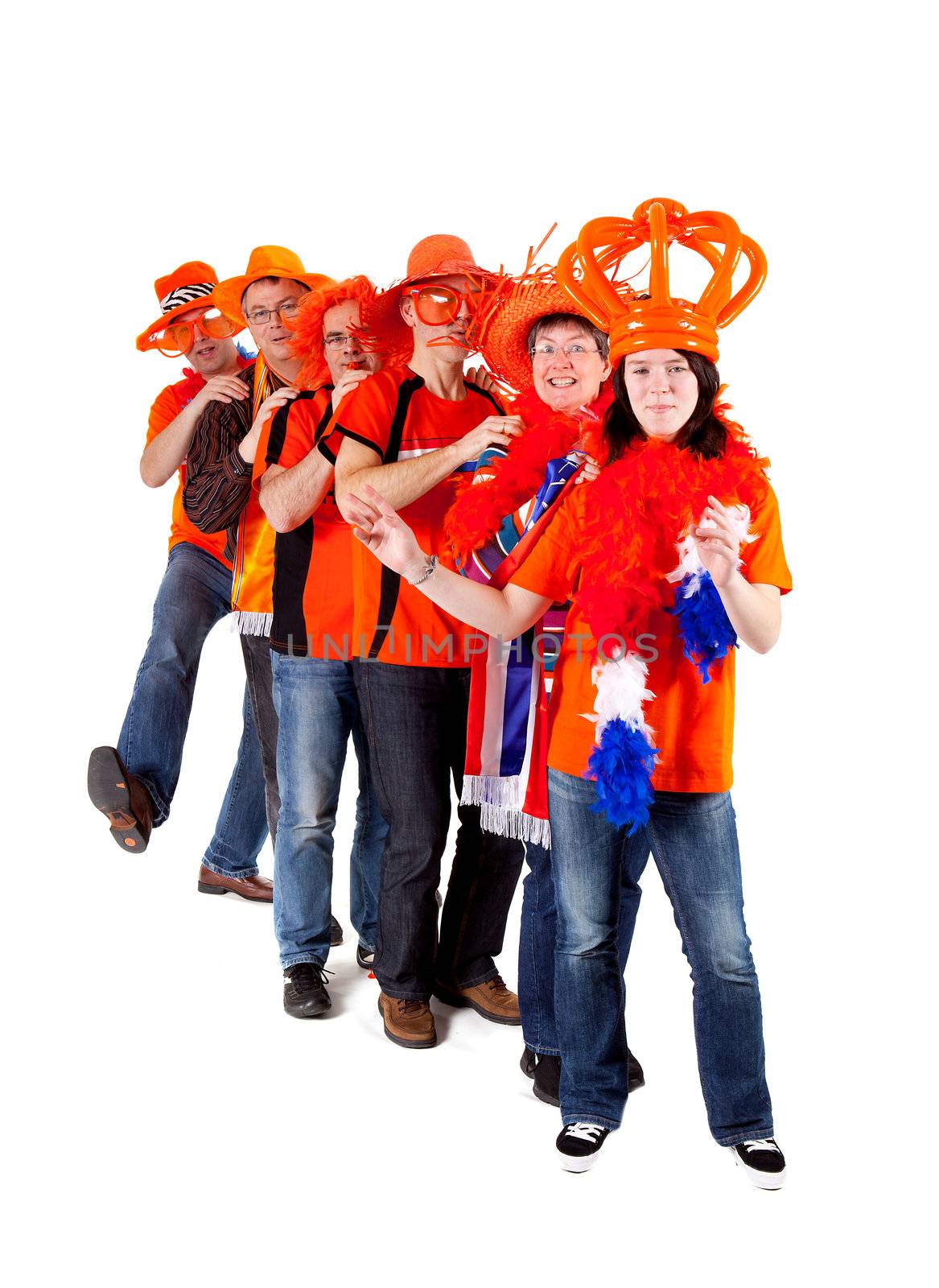 Group of Dutch soccer fans in polonaise over white background