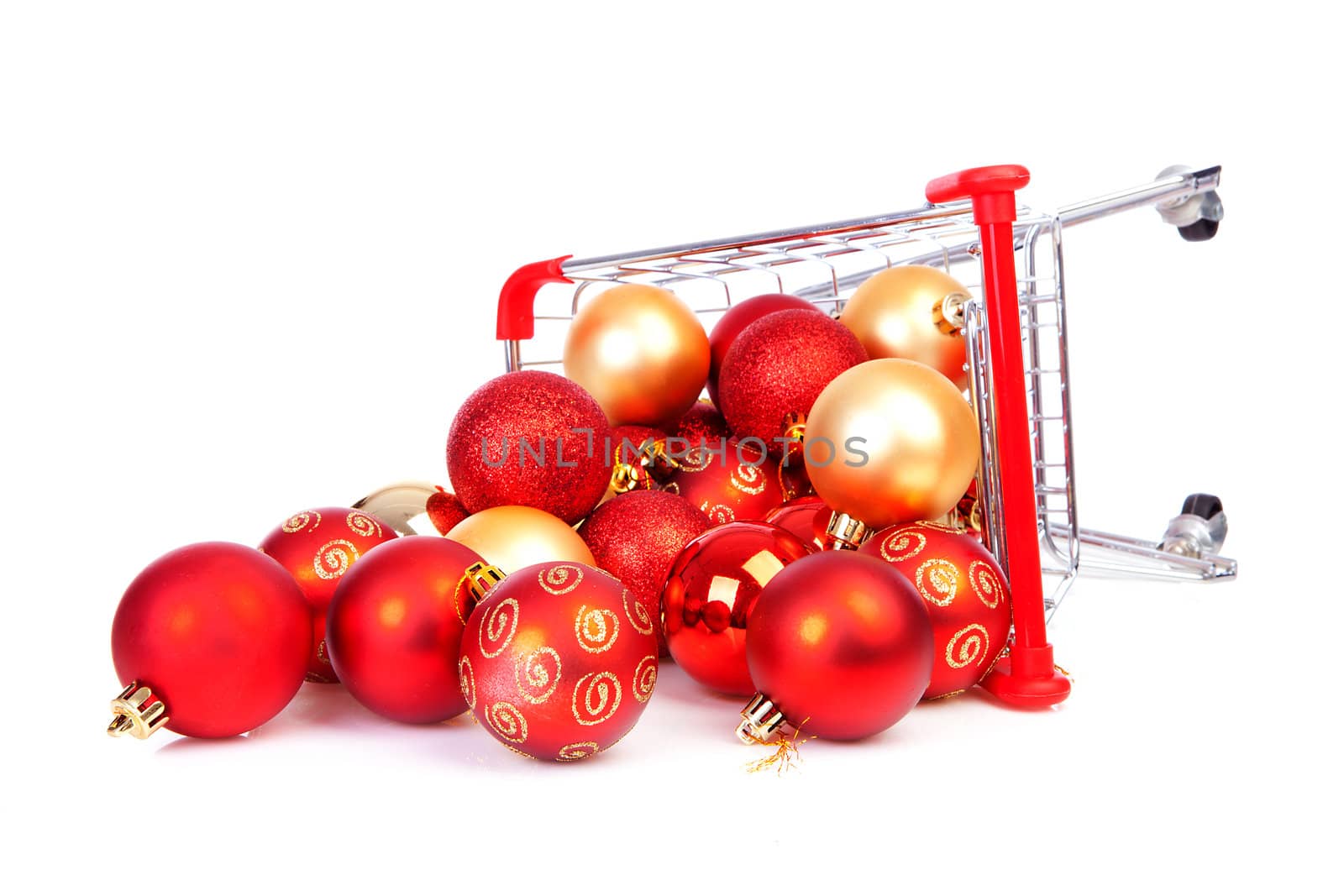 Falling Shopping cart with Christmas balls over white background