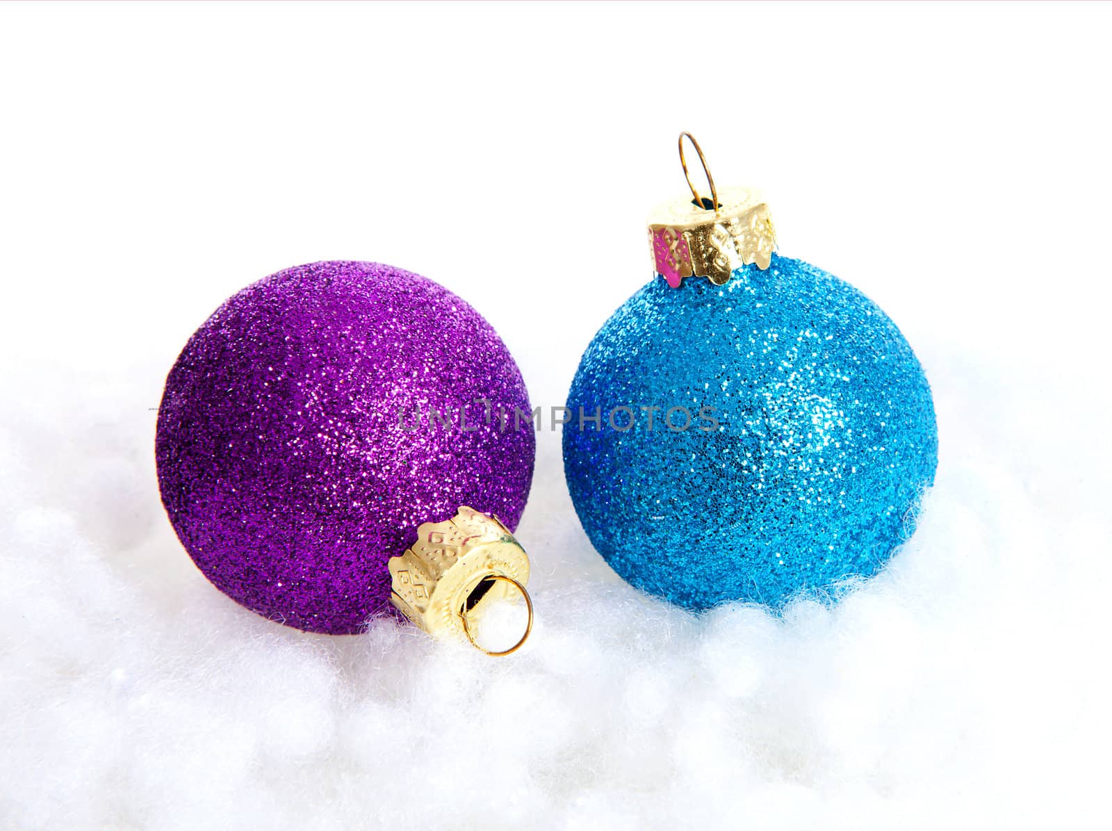 Two colorful sparkling Christmas balls over white background