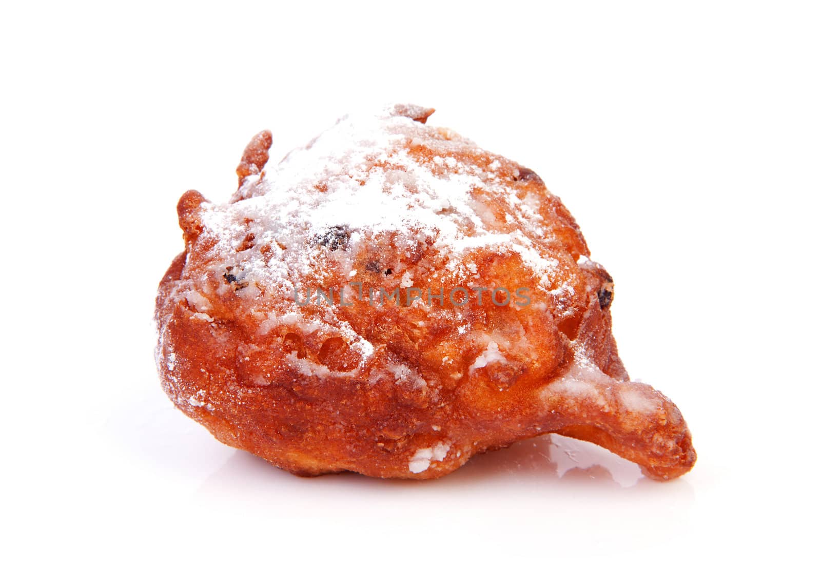 Dutch donut also known as oliebol over white background